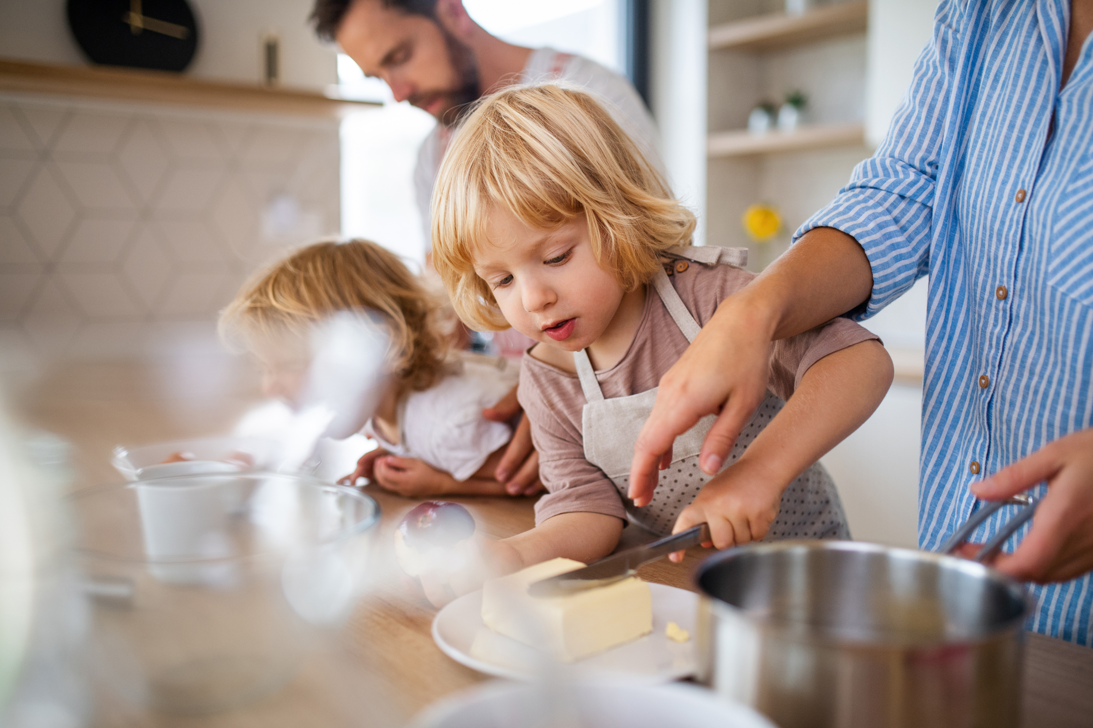 Family with child preparing baked goods